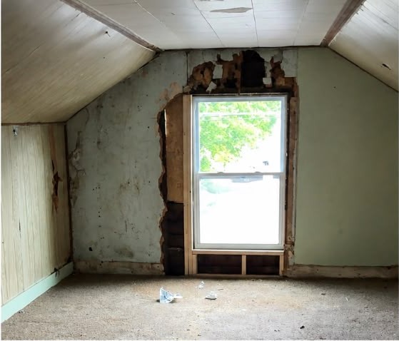 Before: Upstairs bedroom — new drywall, window trim, lighting and floors.